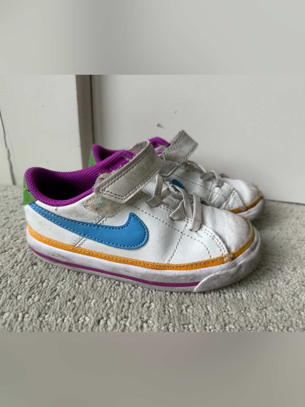 Nike Kids White Sneakers with Blue Swoosh and Purple Lining